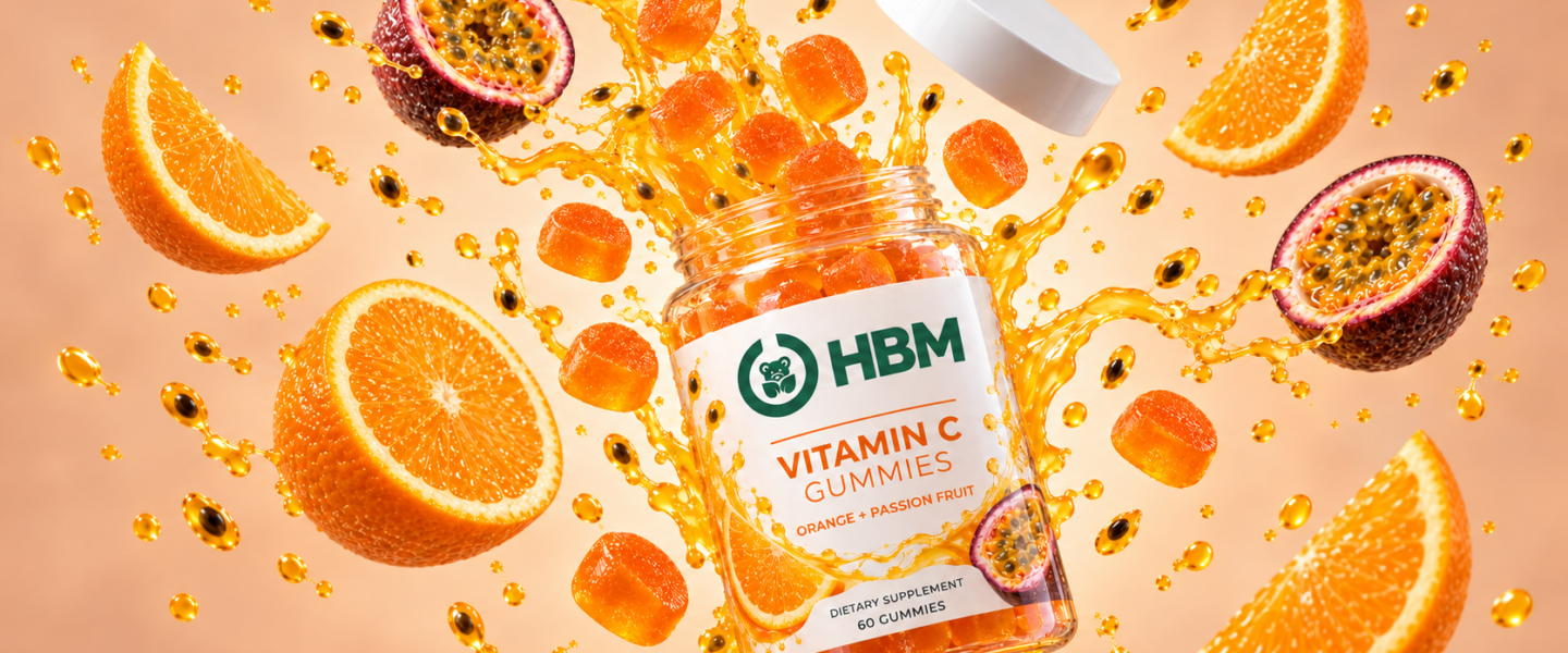 Fine white vitamin C powder with sliced citrus, amber laboratory glassware and stainless-steel supplement manufacturing equipment.